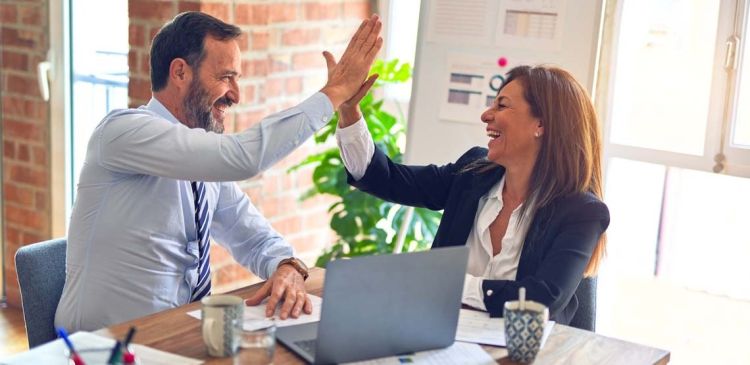 Two people highfiving